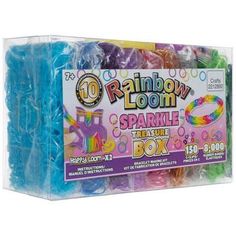 the rainbow loom sparkle treat box is filled with colorful beads and plastic wrappers