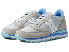 Saucony Originals Jazz Triple - Women's Shoes : Grey/Blue : Stretch your legs and feet in the comfort of the Saucony Originals Jazz Triple sneaker. Textile and synthetic upper. Lace-up closure. Round-toe silhouette. Textile lining and insole. Synthetic outsole. Imported. Measurements: Weight: 10 oz Product measurements were taken using size 8.5, width B - Medium. Please note that measurements may vary by size. Weight of footwear is based on a single item, not a pair. Gray Slip-resistant High-top Sneakers, Casual Nylon Running Shoes With Cushioned Footbed, Gray Running Sneakers With Removable Insole, Nylon Lace-up Athletic Sneakers, Casual Nylon Sneakers With Rubber Sole, Comfortable Nylon Lace-up Sneakers, Mid-top Synthetic Slip-resistant Sneakers, Gray Low-top Sneakers With Removable Insole, High-top Slip-resistant Sneakers With Secure Fit