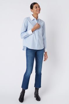 Simplicity is key with our new Classic button front shirt. Made in our European cotton with contrast collar & cuffs, this style is a great addition to your wardrobe. Dress it up or down, the options are endless. Classic collar and cuff construction, button front closure, easy fit, double back pleats, back yoke with our signature loop detail. - 100% Cotton - Made in NYC - Professional dry clean or machine wash - Our model is 5'9" wearing size S - Chest 40", Hip 43", Length 26" Orders are processe Classic Button-up Top With Contrast Collar, Workwear Shirt With Contrast Spread Collar, Workwear Shirt With Contrast Collar, Blue Shirt With Striped Cuffs For Work, Blue Striped Cuffs Shirt For Workwear, Workwear Tops With Contrast Spread Collar, Blue Shirt With Cuffed Sleeves And Spread Collar, Blue Shirt With Button Cuffs And Shirttail Hem, Workwear Button-up Top With Striped Cuffs