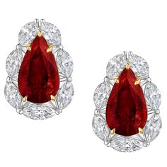 Pear shaped Rubies weighing 9.12 Carats. GIA Certified. Surrounded by Marquise shaped Diamonds weighing 4.28 Carats. Graded D-F color, SI clarity. Each certified by GIA. Will come in a booklet with 16 GIA Certificates. Set in Platinum and 18 Karat Yellow Gold. Ruby And Diamond Earrings, Marquise Shape Diamond, Red Jewelry, Expensive Jewelry, Gemstones Jewelry, Ruby Diamond, Pear Shaped, Beautiful Things, Amazing Women