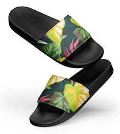 Discover the beauty of botanicals with our exquisite collection of women's slide sandals. From lush gardens to tropical paradise, our botanical-inspired slides add a touch of natural elegance to any occasion. A must-have for the summer: these women's slides. A pair of these will keep you comfy throughout your day of beach or pool activities, thanks to the cushioned upper strap and the textured footbed.  * Cushioned and durable faux leather upper strap * Lightweight polyurethane (PU) outsole * Contoured, textured footbed * Stitched around the upper perimeter for extra durability * Spot clean only * Printed, cut, and handmade * Blank product sourced from China Important: This product is available in the following countries: United States, Canada, Australia, United Kingdom, New Zealand, Japan Tropical Style Sandals With Round Toe For Summer, Open Toe Tropical Sandals For Spring, Tropical Open Toe Sandals For Spring, Flat Tropical Sandals For Summer, Tropical Flat Sandals For Vacation, Tropical Open Toe Sandals For Vacation, Green Flip Flops With Removable Insole For Vacation, Black Tropical Sandals For Vacation, Pool Activities