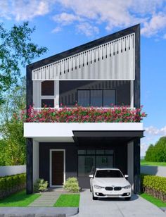 a white car parked in front of a building with flowers on the balconies