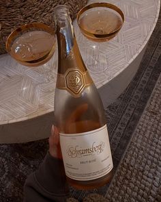 a bottle of champagne sitting on top of a table