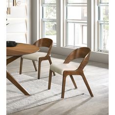 Add a modern touch to your living space with this woodson dining chair. Featuring a wooden frame with rich walnut veneer on solid wood legs, this chair is designed to last. Soft light linen-like polyester fabric upholsters its foam seat, providing a comfortable place for you to sit. Its midcentury modern design is the perfect fit for any contemporary living space, providing your home with a warm touch that stands out. Wade Logan® Upholstery Color: Beige | Wade Logan® Caihden Side Chair 30.2 H x Ercol Furniture, Wood Side Chair, Midcentury Modern Dining Chairs, Gray Dining Chairs, Comfortable Place, Grey Dining, Mid Century Modern Dining, Meridian Furniture, Contemporary Living Spaces