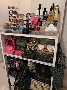 a shelf filled with lots of purses and handbags on top of a tiled floor