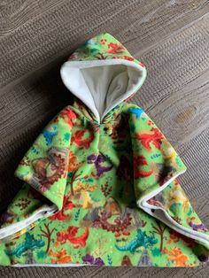 the hoodie is made out of colorful fabric and has an animal print on it