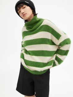 Details: Striped sweater in rich grass green fused with white color scheme High neck design, both practicality and sense of style Green and white stripe color clash, visually fresh and clean Loose hemline with ribbed edging Materials & Care: Other Specialty Animal Hair 100%(with traces of other fibers) Do not wash, gentle dry clean Do not bleach Size & Fit: Model is 5'7", Bust 32, Waist 24, Hips 35, wearing a size S Item #: JM3KT02 White Striped Hem Sweater For Fall, White Striped Hem Sweater For Winter, White Striped Sweater, High Neck Designs, Grass Green, Sale Promotion, Chic Me, Green Grass, Knit Fashion