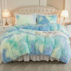 a bed with blue and green fur on it