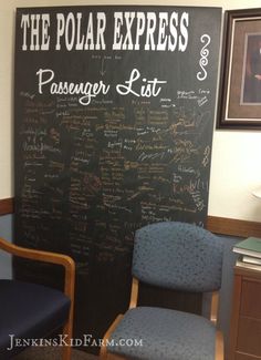 a blackboard with writing on it and two chairs