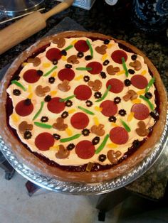 a pizza sitting on top of a pan covered in cheese and pepperoni toppings