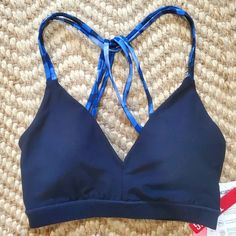 This Navy Blue Sports Bra Is Brand New With Tags Still Attached. The Pads Are Removable. I'd Say It Fits True To Size. Sporty Fitted V-neck Swimwear, Sporty Blue Tops With Medium Bust Support, Athleisure Triangle Top Sports Bra, Fitted Blue T-back Sports Bra, Sporty V-neck Beach Tops, Sporty Fitted Sports Bra With Triangle Top, Sporty Fitted Triangle Top Sports Bra, Seamless V-neck Sports Swimwear, V-neck Stretch Swimwear For Workout