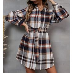 Elevate Your Style Game With This Long Plaid Printed Shacket Jacket. This Versatile Midi-Length Coat Dress Is Designed To Impress, Featuring A Gorgeous Multicolored Plaid Print, Lapel Collar And Distinctive Flap Pockets. The Detachable Adjustable Belt Cinches Your Waist Perfectly, Creating A Flattering Silhouette That's Sure To Turn Heads. Whether You're Layering Up For The Cooler Months Or Adding A Stylish Touch To Your Ensemble, This Shacket Trench Coat Is The Ultimate Go-To Piece. With Its On Fall Knee-length Single-breasted Outerwear, Casual Fall Shirt Dress With Pockets, White Fall Shirt Dress For Daywear, White Shirt Dress For Fall Daywear, White Shirt Dress For Daywear In Fall, Fall Workwear Shirt Dress With Pockets, Fall Shirt Dress With Pockets For Work, Casual Fall Button-up Shirt Dress, Fall Collared Shirt Dress With Pockets