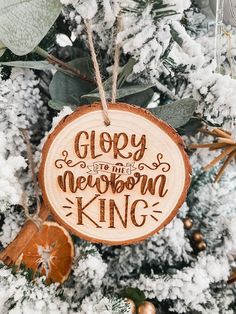 a wooden ornament hanging from a christmas tree