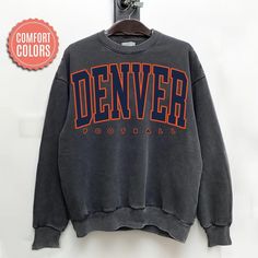 Comfort Colors Denver Football Sweatshirt, Denver Football Sweater, Vintage Style Denver Football Shirt, Denver Football fan Gift -Please check Color and Size Charts before placing the order. You can find them in the listing's photos (Depending on what device you are viewing this listing colors may vary slightly). -Returns and exchanges are accepted only if there are defects "No Extra Costs" We create custom t-shirts with great designs for everyone's liking. If you don't find the size or color y Football Sweater, Gifts For Football Fans, Football Sweatshirt, Sweater Vintage, Custom T Shirts, Football Shirt, Football Fans, Size Charts, Football Shirts