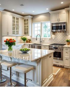 a large kitchen with white cabinets and marble counter tops, an island in the middle is surrounded by stools