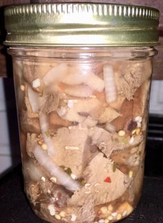 a jar filled with lots of different types of food