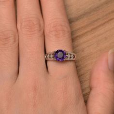 It is a natural amethyst ring, octagon cut, measures 7mm*7mm, weight about 1.46 cts. The basic metal is sterling silver and plated with rhodium. To change the metal to a solid gold (white/rose) or platinum is also available, please ask for a quotation if you want. You can also go to my shop Home for more elegant rings: https://www.etsy.com/shop/godjewelry?ref=hdr_shop_menu amethyst is birthstone of February More amethyst rings: https://www.etsy.com/shop/godjewelry?ref=seller-platform-mcnav&s Classic Amethyst Birthstone Ring With Accent Stones, Silver Emerald Cut Amethyst Ring, Octagon Sapphire Ring For Anniversary, Octagon Sapphire Birthstone Ring For Anniversary, Classic Amethyst Birthstone Promise Ring, Octagon Sapphire Ring Birthstone For Anniversary, Classic Sterling Silver Amethyst Ring With Emerald Cut, Emerald-cut Amethyst Ring For Anniversary, Classic Emerald Cut Amethyst Ring In Sterling Silver