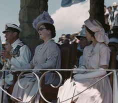 several people sitting in chairs with hats on and one person holding a trumpet while others watch