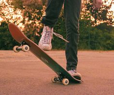 a person standing on top of a skateboard