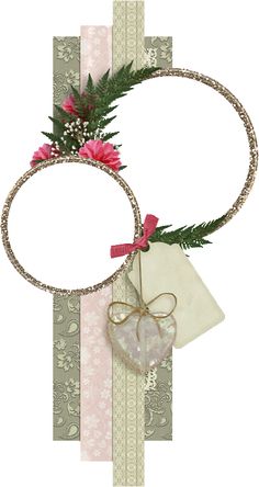 a circle frame with pink flowers and ribbon on it, surrounded by other decorative items