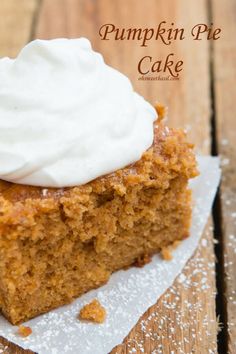 a piece of pumpkin pie with whipped cream on top sitting on a white paper towel