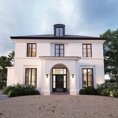 a white two story house with black trim