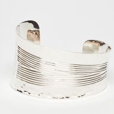 This very unique cuff is a single block of sterling silver that is flattened to a 1MM gauge, then carefully cut into a triangle.  The center is hand-edged from end to end, and to add to its rich texture, the edges are hand-pounded.  

This cuff is artistry from beginning to end.  One side of the cuff is 1.6" tall and the other end is .8" tall.  This contemporary design, with a tasteful asymmetrical curve will fit a small or large wrist. Rich Textures, Artisan Craft, Silver Cuff, Silver Bracelets, Sterling Silver Bracelets, Sterling Silver Jewelry, Contemporary Design, Cuff Bracelets, Silver Jewelry