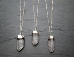 "Raw quartz crystal plated in silver on a sterling silver chain (custom length to your preference.) These raw, uncut stones are from Spain. Quartz provides clarity and positivity. The most abundant mineral in the world Quartz is known as the master healing crystal amplifying stability and healing. Your one-of-a-kind necklace will arrive in a gift box and on a hang tag noting the metaphysical properties of the crystal. Stone: Quartz, raw points Size: select from 4 available options Color: Clear w Raw Quartz Necklace, Rough Quartz, Raw Quartz Crystal, Ideas Jewelry, Crystal Pendants, Gemstone Pendants, Raw Quartz, Crystal Necklaces, Buy Crystals