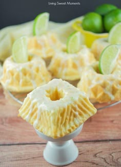 a dessert dish with limes on the side