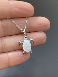 "Small Sterling Silver White Opal Turtle Necklace Dainty and Minimalist Necklace Metal: All Components Are Made From Solid .925 Sterling Silver Stone: Lab created Opal Measurement: pendant is approx. 25mm (0.98\") and 14mm (0.55\") wide You can enter my storefront here https://www.etsy.com/shop/LinksAndStones Please Read Store Policy Before Purchase Thank You For Visiting My Shop NK0011" White Opal Earrings, October Birthstone Jewelry, Small Dangle Earrings, Opal Birthstone, Starburst Earrings, Fire Opal Necklace, Turtle Necklace, Turtle Pendant, Dainty Gold Necklace