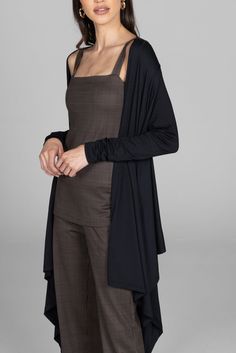 Why we love this: Wrap yourself in style with our knit wrap top. Crafted from soft and stretchy fabric, this versatile ensemble combines comfort and sophistication, making it a perfect choice for effortlessly chic looks. Features: KiraGrace Luxe: Feels ultra-soft and luxurious Light and flowy Perfectly transitions from studio to street Beautiful draping design Made in U.S.A. of imported fabric FIT: Loose and flowy fit COVERAGE: Wrap design SIZING: True to size IMPACT: Light for versatility Fits Versatile Fitted Cardigan For Layering, Versatile Fitted Wrap Cardigan, Versatile Fitted Open Front Cardigan, Fitted Open Front Versatile Cardigan, Elegant Long Sleeve Shrug For Workwear, Fitted Versatile Wrap Outerwear, Versatile Fitted Wrap Outerwear, Versatile Open Front Cardigan For Layering, Elegant Open Front Cardigan For Loungewear