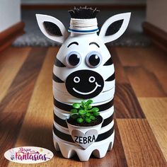 a zebra planter with a potted plant in it's mouth and eyes