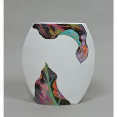 a white vase with colorful designs on it