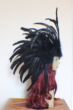 "This is a custom \"made to Order\" listing for a full all black feather headdress with feather side plumes and and a front feather plume on a bendable pose-able black vine covered wire crown. Feathers will be black and natural black with a natural iridescence in the feather coloration. SIZE: Side feather plumes will measure around 20''x 16'' and the front feather panel will measure around 6''x 14''. CREATION TIME: Please allow 1-2 weeks for creation time before shipping. I will update you on th Wire Crown, Feather Headdress, Costume Hats, Black Feathers, Headdress, Headpiece, All Black, Feathers, Custom Made