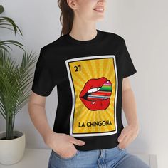 La Chingona the Badass Loteria Unisex T-shirt - Etsy Funny Fan Merchandise Tops With Sublimation Print, Funny Tops With Sublimation Print For Fans, Funny Crew Neck Top With Front Print, Funny Print Graphic Tee For Fan Merchandise, Funny Print Graphic Tee For Fans, Graphic Tee With Funny Print For Fans, Funny Graphic Print Top For Fans, Funny Graphic Print Tops For Fan Merchandise, Funny Graphic Design Tops With Relaxed Fit