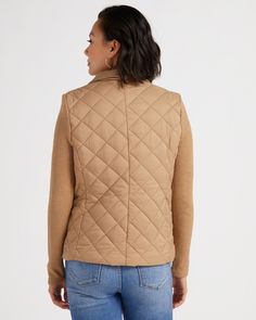 A quilted jacket with a 2-in-1 vibe for ultimate coziness! Regular fit with a zip-up front, two snap pockets and a mock neck. Made of a quilted nylon body and stretchy-soft knit sleeves. | Quilted Zip Jacket With Ribbed Sleeves for Women by Jaclyn Smith from Wantable Versatile Turtleneck Outerwear For Layering, Versatile Quilted Outerwear For Fall, Versatile Quilted Fall Outerwear, Versatile Quilted Winter Outerwear, Cable Knit Turtleneck Outerwear For Layering, Turtleneck Cable Knit Outerwear For Layering, Fall Outerwear With Padded Collar For Layering, Fall Nylon Quilted Jacket, Nylon Outerwear For Layering In Fall