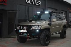 an suv parked in front of a building