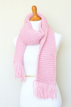 This chunky knit scarf is a cozy addition to any modish fall/winter wardrobe. It's made with wool blend yarn in lovely pink (Blossom) color.The scarf is long, soft and comfy.Please note: I can make this scarf in many other colors. Just contact me for more info.Shown color: Blossom.Machine wash and dry when needed. Pink Knitted Fall Scarf, Pink Knitted Winter Scarves, Pink Knitted Scarves For Winter, Mens Knitted Scarf, Men Scarf, Chunky Knit Scarf, Scarf Chunky, Chunky Knit Scarves, Pink Scarf