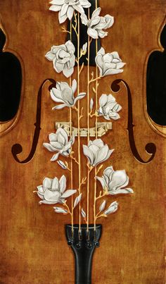 an old violin with flowers painted on it