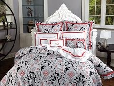 the comforter is black and white with red trimmings on it's edges