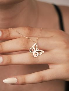 The 14K Gold Butterfly Necklace will bring a touch of elegance and whimsy to any jewelry collection, promising to be a cherished piece for years to come. This minimalist butterfly necklace, crafted with meticulous attention to detail, will capture the delicate beauty of a butterfly in a timeless design. Made from high-quality 14K gold, this dainty butterfly pendant will symbolize transformation and new beginnings, making it an ideal gift for anniversaries or special milestones. It will promise to complement any outfit, from casual to formal, adding a subtle yet captivating charm. The necklace's fine craftsmanship and durability will ensure it remains a treasured accessory, perfect for women who appreciate both simplicity and sophistication. Features and Benefits ✅ 14K gold construction ✅ M Delicate Luxury Butterfly Necklace For Gift, Luxury Yellow Gold Butterfly Necklace Dainty, 14k Gold Butterfly Necklace, Minimalist Butterfly, Gold Butterfly Necklace, Dainty Butterfly, Spiritual Necklace, Butterfly Necklace Gold, Necklace Butterfly