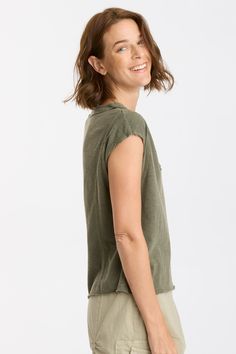 Interesting sleeve seams and raw edges bring some unexpected details to this jersey v-neck tee. Effie Slub Jersey: 60/40 Cotton/Modal. Center Front: ~14.5". Center Back: ~21". Color Description: Leafy green. Preshrunk. Machine washable. Imported. MODEL Whitney is wearing size Small. Height: 5'10" | Bust: 34A | Waist: 26" | Hip: 37" Cotton V-neck Open Knit Top, Casual Distressed V-neck Top, Cotton V-neck Athleisure T-shirt, Cotton V-neck Tops With Frayed Hem, Green Relaxed Fit V-neck Top, Relaxed Fit V-neck Tops With Frayed Hem, Cotton Stretch V-neck Short Sleeve Top, Solid Moisture-wicking V-neck T-shirt, Skirt Crop