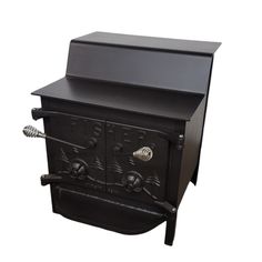 an old fashioned black stove with two ovens