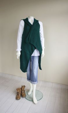 I knitted with love this Forest Green long vest. ( Belt is not included.) This beautiful Green Oversized Knit Vest is perfect for the changing weather, and will be fun to wear all season long. This Long Knit Top is cozy and stylish. It s very soft and warm. This Knitted Vest is easy to change around for many different looks and styles. One size fits all If you are interested in a particular color,let me know. Perfect for your self or as a gift for that special someone and Mother's day gift. This Knitted Winter Vest, Green Sweater Vest For Winter Layering, Green Knitted Winter Vest, Knit Vest Outerwear For Winter, Winter Knit Vest Outerwear, Knitted Vest For Winter, Green Winter Vest For Layering, Sleeveless Knit Cardigan For Winter, Green Winter Layering Vest