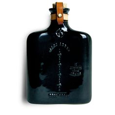 a black flask with a cross on it