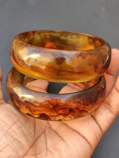 you will receive 1 Piece of Vintage Smooth Honey color Resin Bangle Bracelet Chunky Bangle Statement Purely Handcrafted Bohemian Unique Fashion Jewelry Gift Sale. Inner diameter size - 2.6" approx. Width Size: 23 mm. Thank you very much for visiting! Any questions, please feel free to contact us. Discount for bulk provide. Handmade Brown Round Bangle, Brown Bohemian Bangle Bracelet, Bohemian Brown Bangle Bracelet, Orange Bohemian Bangle Bracelet, Bohemian Orange Bangle Bracelet, Handmade Bohemian Brown Bangle, Handmade Brown Bohemian Bangle, Bohemian Handmade Brown Bangle, Handmade Orange Cuff Bracelet Bangle