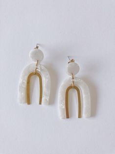 Modern White Earrings With Ear Wire, Minimalist White Jewelry With Matching Earrings, Modern White Everyday Jewelry, Simple White Hypoallergenic Jewelry, Simple White Drop Earrings, White Hypoallergenic Earrings For Everyday, Minimalist White Drop Earrings, Simple White Earrings For Everyday, Minimalist White Jewelry For Pierced Ears