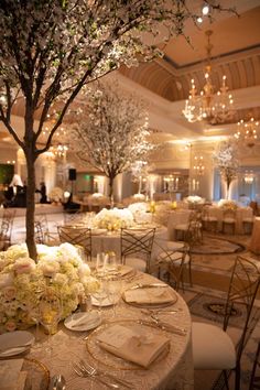 the tables are set with white flowers and place settings for an elegant wedding reception at the fairmont hotel