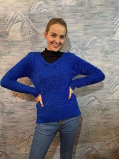 "90s Blue Fuzzy Sweater Fringe Fuzzy Knitted Jumper Medium Size Hipster Sweater Vintage Pullover Club Kid Puffy Sweater Estimated size: M Measurements: (lying flat) Length: 24.5\" / 62 cm Pit to pit: 17\" / 43 cm Waist: 14\" / 36 cm Shoulder: 16\" / 41 cm Sleeve: 24\" / 61 cm Please check measurements to insure a proper fit. Remember to allow yourself some extra room for movement. You can compare these with something from your closet that fits you well. This sweater will come to you freshly laun Blue V-neck Soft Knit Sweater, Blue Knit V-neck Long Sleeve Sweater, Trendy Blue V-neck Sweater For Winter, Blue Knit V-neck Sweater For Winter, Cozy Blue Stretch Sweater, Cozy Blue V-neck Sweater, Cozy Stretch Blue Sweater, Blue Knit Long Sleeve V-neck Sweater, Blue Knitted V-neck Sweater