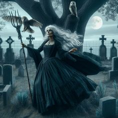 a woman with long white hair and black dress holding an owl in her hand while standing next to a cemetery